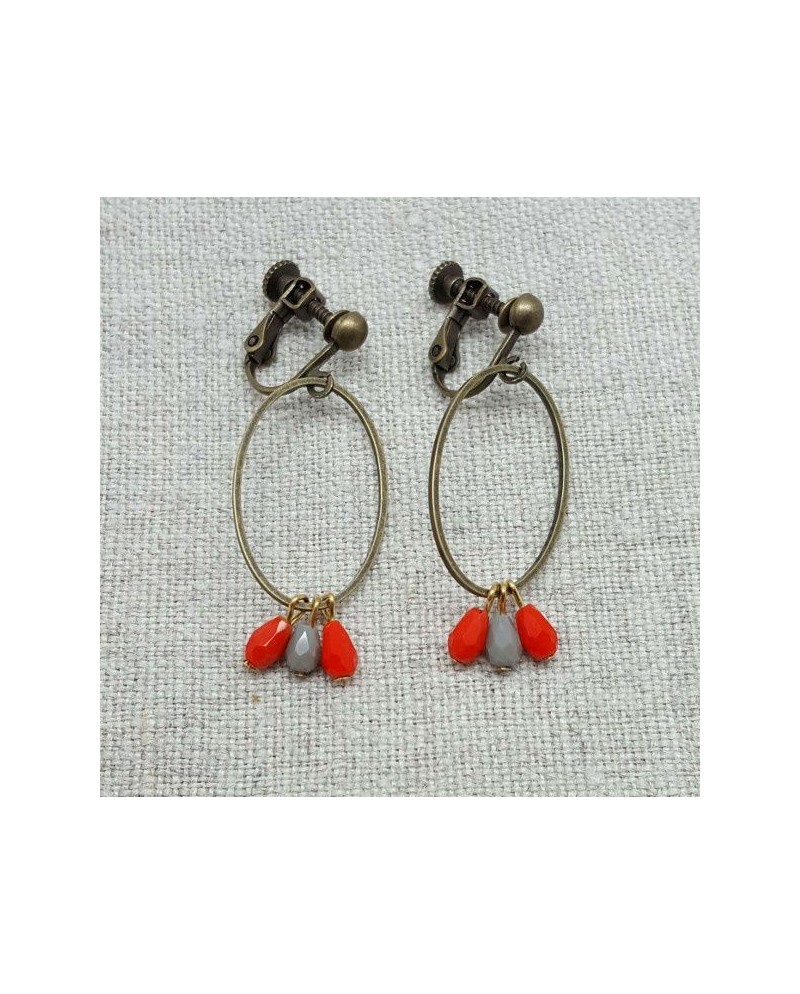 Boucle d'oreille ovale et perles oranges