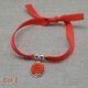 Bracelet religieux médaille miraculeuse ou croix émaillée sur lien elastique ajustable orange