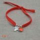 Bracelet religieux croix en nacre et médaille vierge orange sur lien elastique 