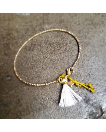 Bracelet jonc irisé Plaqué Or avec pompon et breloque, ajustable.