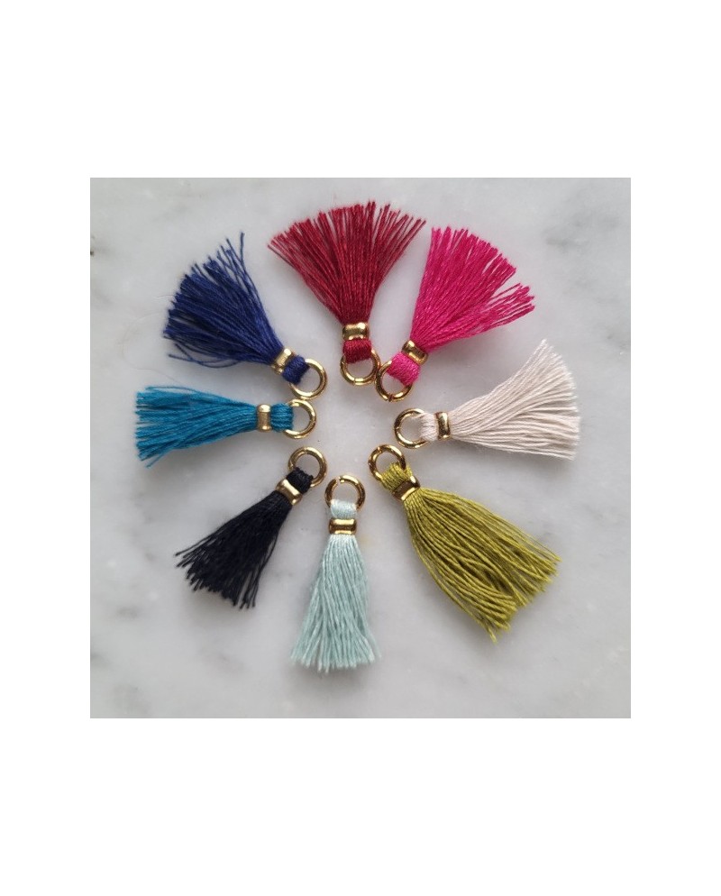 bracelet religieux plaqué Or avec breloque colombe et pompon coloré.