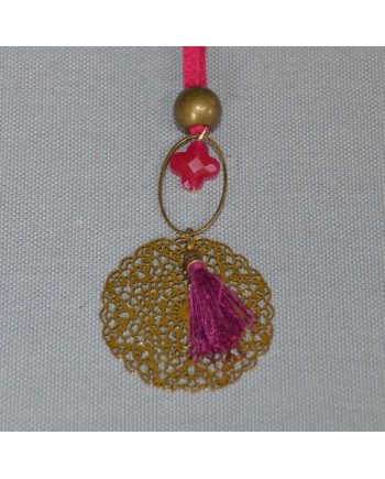 Sautoir pompon et arabesque sur lien suedine